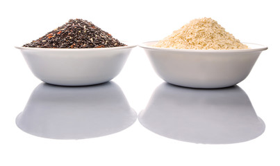 Black and white glutinous rice in bowl over white background