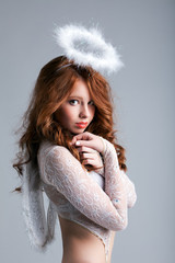 Portrait of lovely red-haired angel