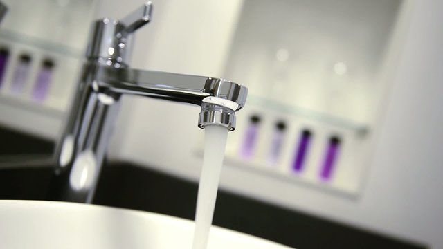 sink faucet opened