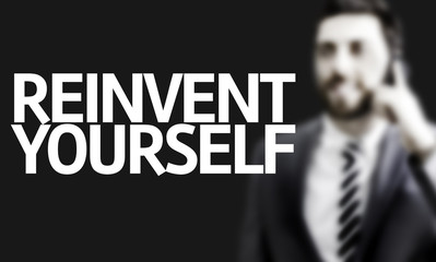 Business man with the text Reinvent Yourself