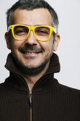 Obraz premium Portrait of a Man with Yellow Eye Glasses
