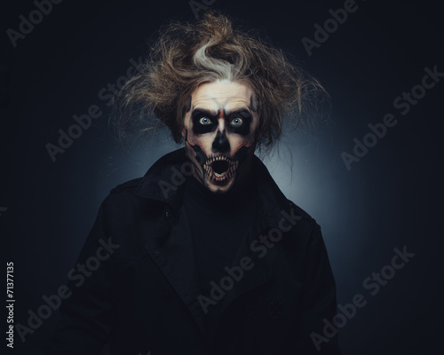 Portrait of man with Halloween skull makeup