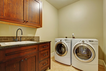 Laundry room with modern appliances