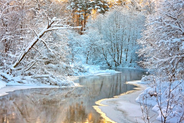 winter landscape with a river at sunset