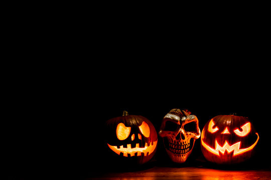 Scary Halloween pumpkins isolated on black