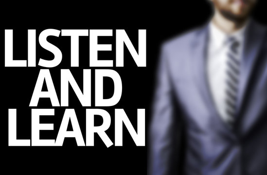 Business man with the text Listen and Learn
