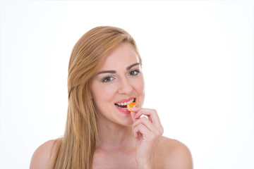 Smiley girl bites citrus fruit – Happy woman eats a portion of