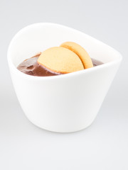 one cup of pudding with biscuits