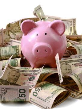 piggy bank on dollars, isolated on white background.