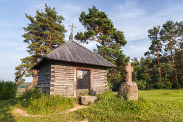 Ancient Orthodox chapel and a stone cross on Savkina gorka