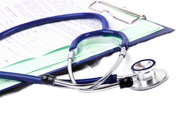 Stethoscope on medical billing statement on table, all text is