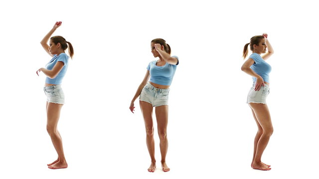 Beautiful sexy woman in shorts and T-shirt dancing and listening