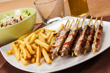 Pork skewers with french fries