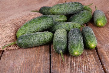 Cucumbers on wooden background