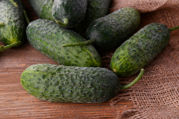 Cucumbers on wooden background