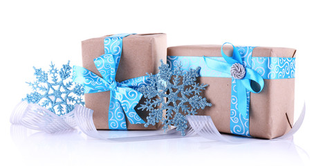 Holiday gift boxes decorated with blue ribbon isolated on white