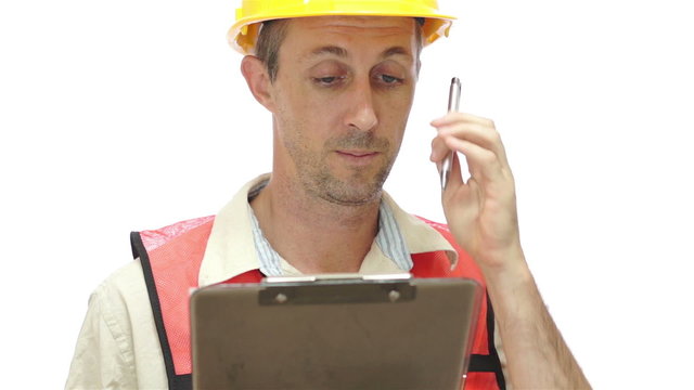 Male Worker With Clipboard Rubbing Head