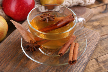 Composition of  apple cider with cinnamon sticks, fresh apples,