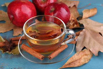 Composition of  apple cider with cinnamon sticks, fresh red