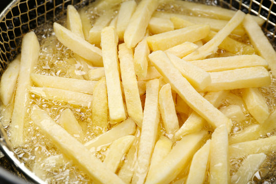 French Fries In Deep Fryer, Closeup