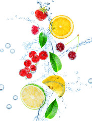 Fresh fruit, berries and green leaves with water splash,