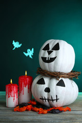 White Halloween pumpkins and candles