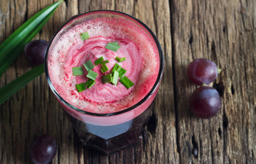 Grape smoothie healthy and herb on wooden table background