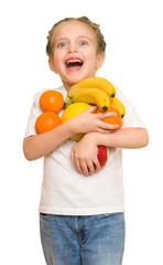 Fototapeta na wymiar little girl with armful fruits