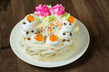 Cream cake with orange Jelly on the wooden table