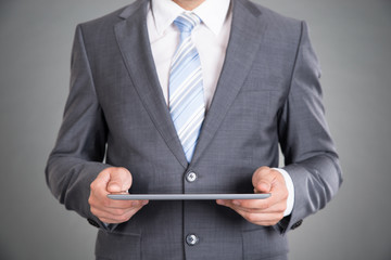 Businessman hands holding tablet computer