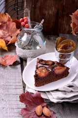 Chocolate cake with plums, selective focus