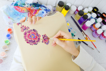 Fototapeta premium Batik process: artist paints on fabric, Batik painting