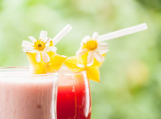 Close up strawberry yogurt and red cherry juice