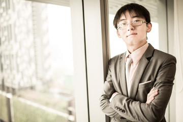 Portrait of a businessman looking at the window