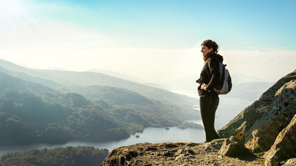 hiker on top of the mountain enjoying view, Ben A'an, Scotland