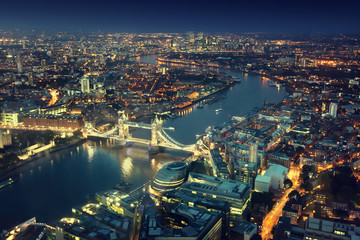 Fototapeta na wymiar London at night with urban architectures and Tower Bridge