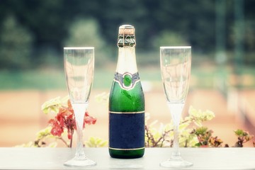 Bottle of champagne and two wineglass