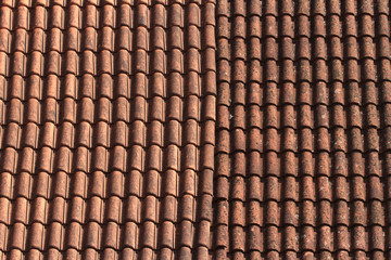 Old ceramic tile roof close up. background