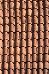 Old terracotta tile roof close up. background vertical