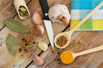 Cooking ingredients and spices on wooden surface
