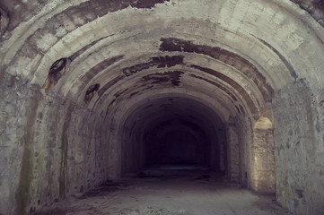 Obraz premium old tunnel of stone and concrete underground