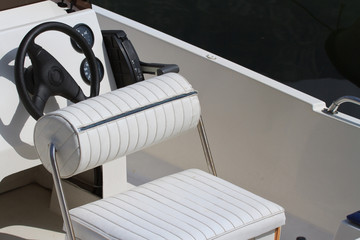 Steering wheel and dashboard of the yacht. Place seat captain