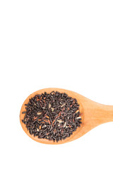 Black glutinous rice on a wooden spoon over white background