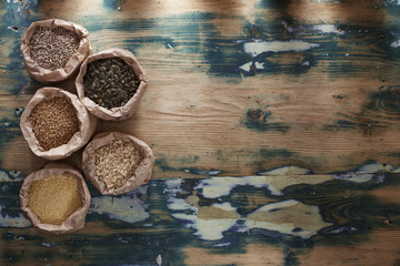 Nut, seed and grain mix on rustic wooden table