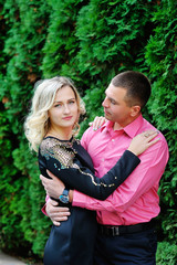 Cute young couple lying in a park