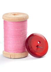 Thread and a button with a needle