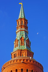 Fototapeta na wymiar Top of the Moscow Kremlin tower with blue sky and moon