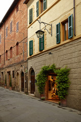 Old small stone medieval street in historical town, Italy