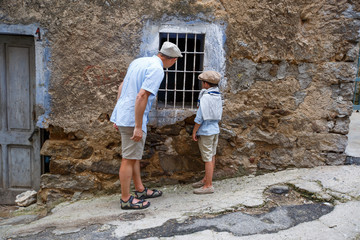 Obraz na płótnie Canvas Father and his son in village Orgosolo, Italy