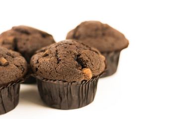 Organic chocolate muffins isolated on white